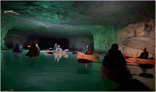 people doing underground kayaking at The Gorge Underground in the Red River Gorge area of Kentucky