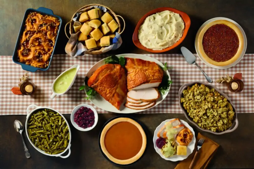 Cracker Barrel comfort food spread with pancakes, biscuits, eggs, and coffee on a rustic dining table