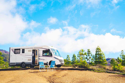 a motorhome, parked in an outdoor setting